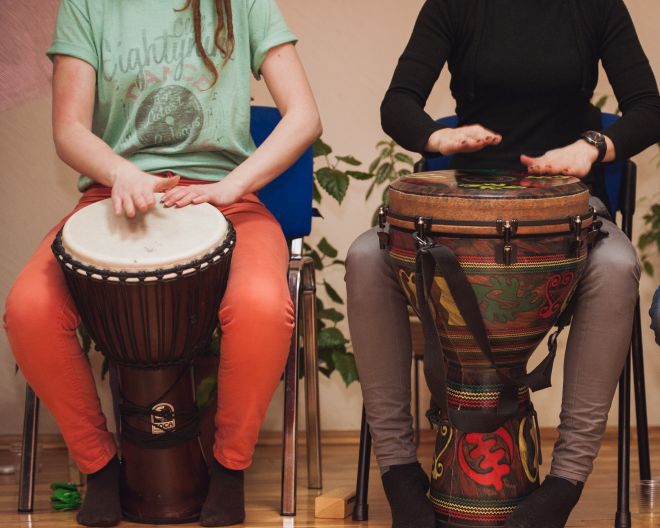 Group of Jambe drummers playing trommel trommeln
